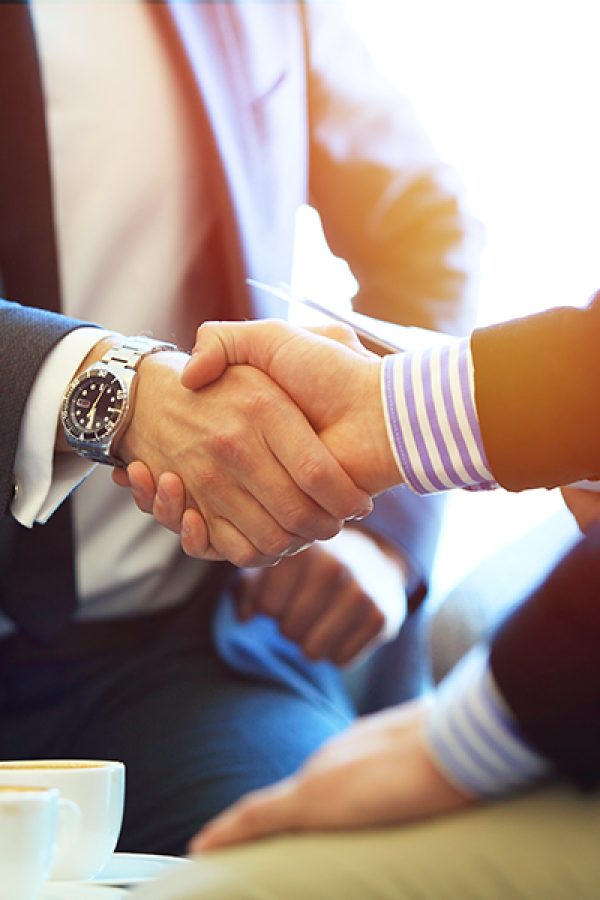 Business people shaking hands, finishing up a meeting
